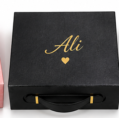 black large gift box with Ali on top
