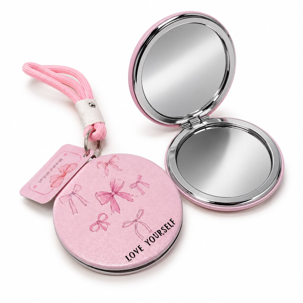 Pink round compact mirror with bow design
