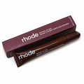 Rhode peptide lip tint in brown shade with box