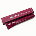 Rhode peptide lip tint in burgundy shade with box