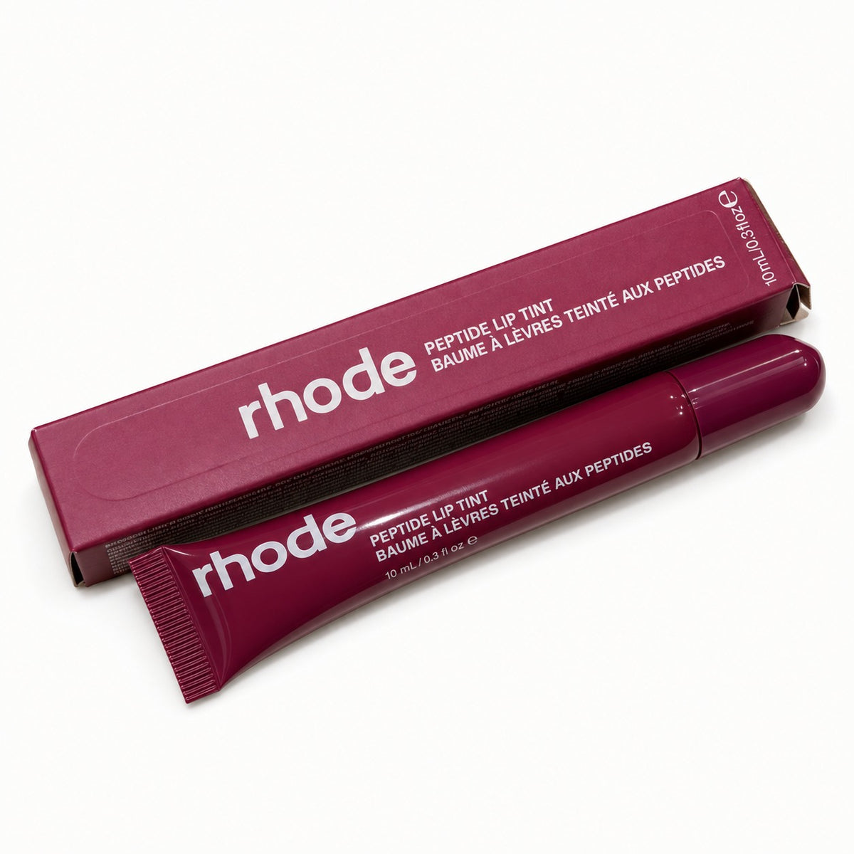 Rhode peptide lip tint in burgundy shade with box