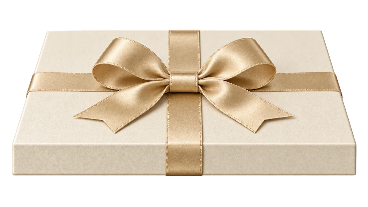 Ivory gift box lid with an elegant champagne bow